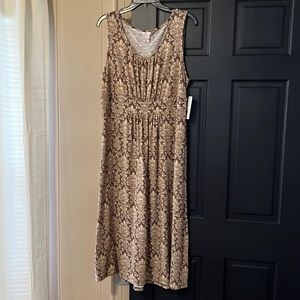New with tags pretty midi sun dress. Very soft material.